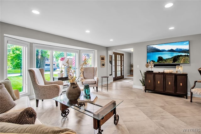 234 Misty Ln, Amherst, NY 14051 - living room featuring healthy amount of natural light, recessed lighting, baseboards, french doors, and light tile patterned flooring