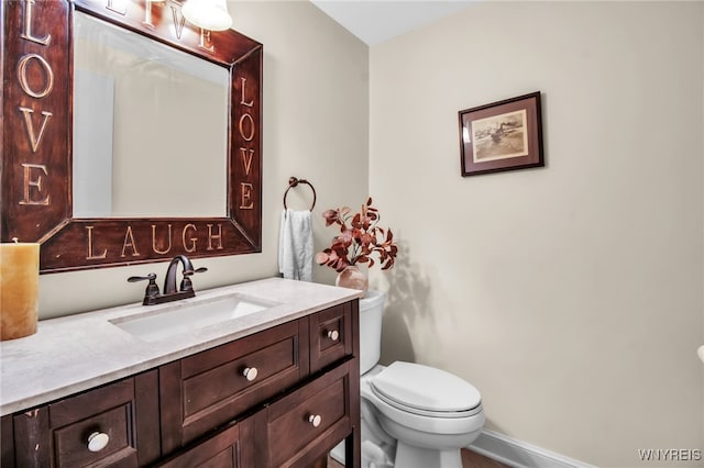 234 Misty Ln, Amherst, NY 14051 - bathroom with toilet, vanity, and baseboards