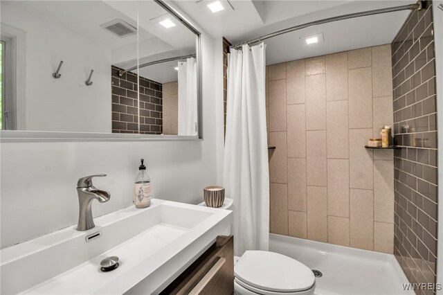 234 Misty Ln, Amherst, NY 14051 - full bath featuring toilet, vanity, and a tile shower