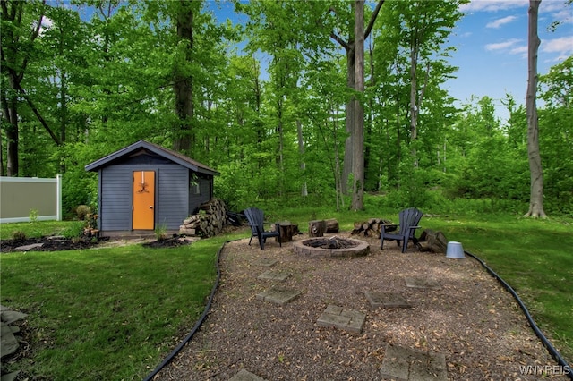 234 Misty Ln, Amherst, NY 14051 - view of green lawn with an outdoor fire pit and an outdoor structure