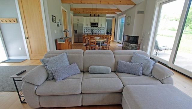 2185 Hog Mountain Rd, Middletown, NY 12455 - living area featuring light wood-style flooring, beam ceiling, and baseboards