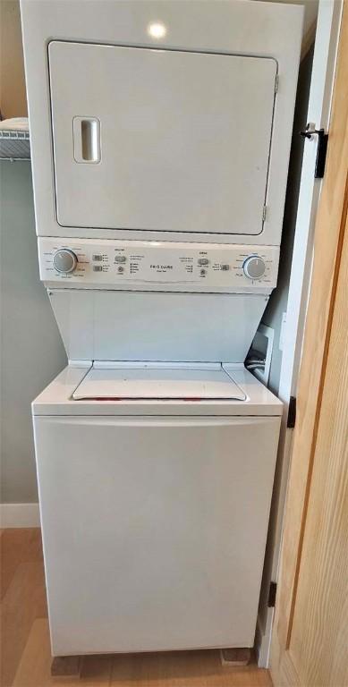 2185 Hog Mountain Rd, Middletown, NY 12455 - laundry area with estacked washer and dryer and baseboards