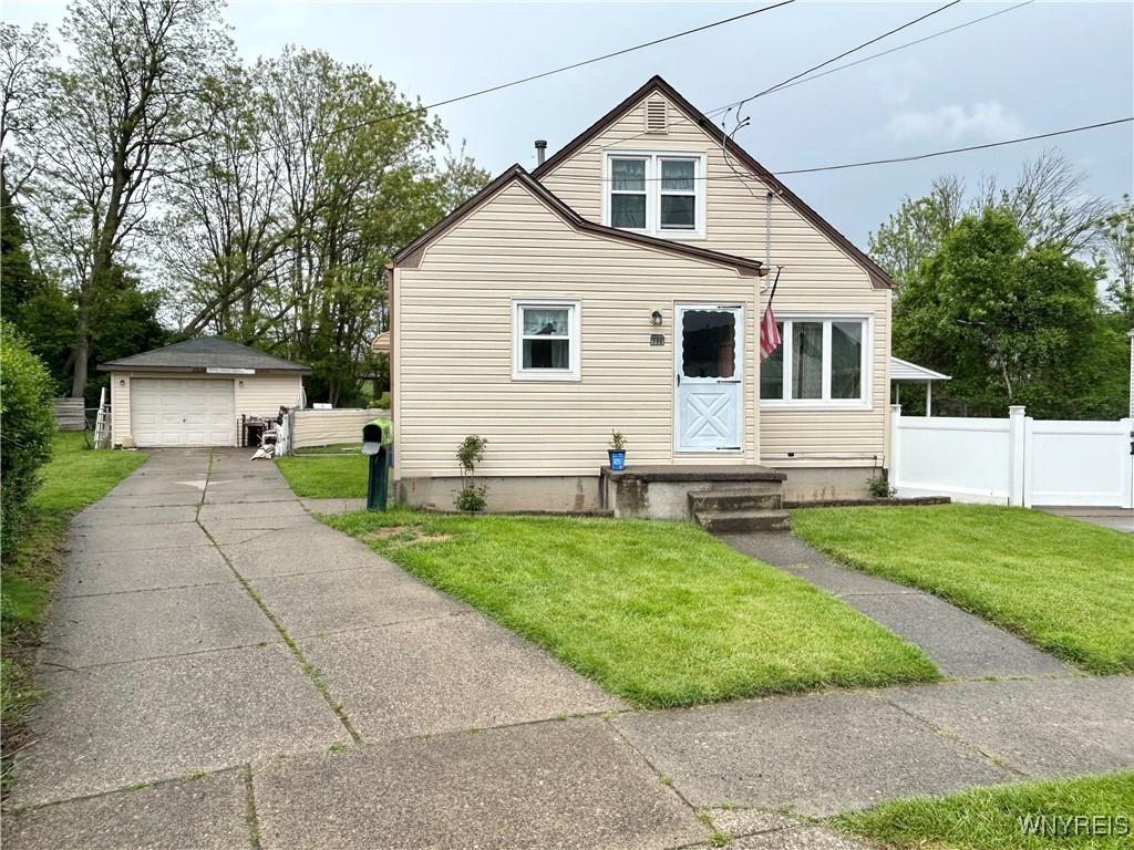 396 Weimar St, Buffalo, NY 14206 - bungalow-style home featuring a garage, an outdoor structure, and driveway