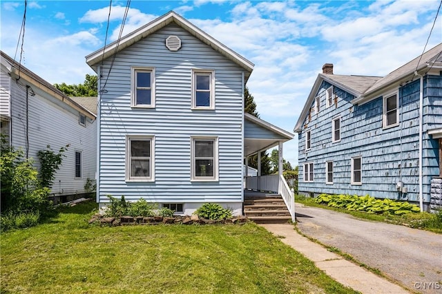 220 W Elm St, Oneida-Inside, NY 13421 - view of front of house featuring covered porch, a front yard, and driveway
