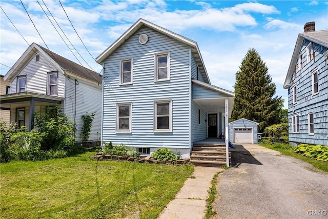 220 W Elm St, Oneida-Inside, NY 13421 - traditional home featuring asphalt driveway, an outdoor structure, a front yard, and a detached garage