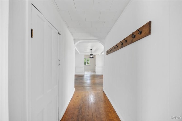220 W Elm St, Oneida-Inside, NY 13421 - hallway with hardwood / wood-style floors and arched walkways