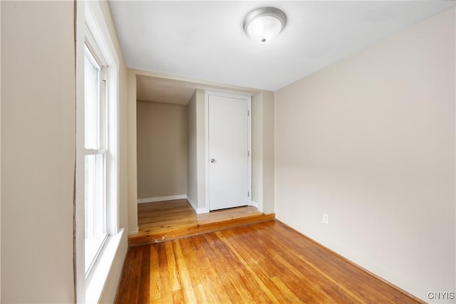 220 W Elm St, Oneida-Inside, NY 13421 - empty room with hardwood / wood-style flooring and baseboards