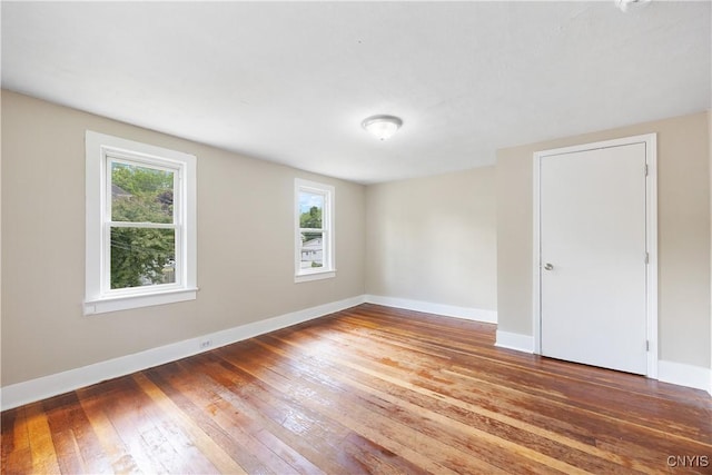 220 W Elm St, Oneida-Inside, NY 13421 - empty room featuring hardwood / wood-style floors and baseboards