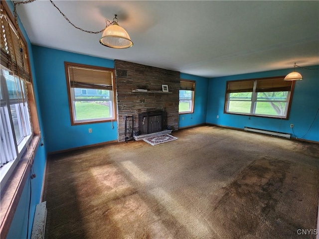 6 Heather Woods Ct, Skaneateles, NY 13152 - unfurnished living room featuring baseboard heating, carpet flooring, and a fireplace