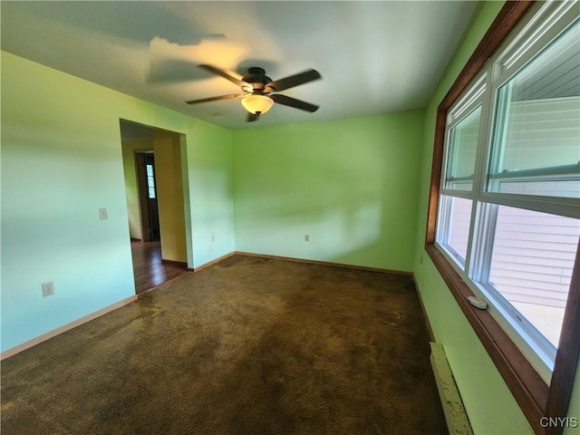 6 Heather Woods Ct, Skaneateles, NY 13152 - unfurnished room with carpet flooring, a ceiling fan, and a baseboard radiator