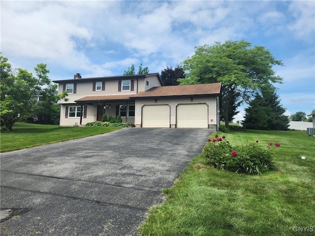 6 Heather Woods Ct, Skaneateles, NY 13152 - view of front of house with an attached garage, asphalt driveway, a front lawn, and a chimney