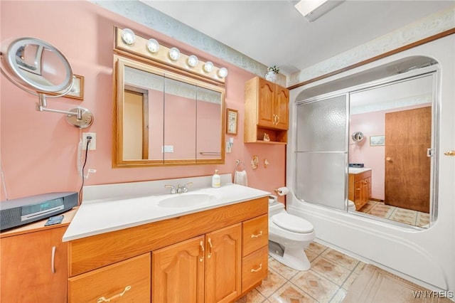 2350 Quaker Rd, Hartland, NY 14067 - full bath featuring vanity, toilet, and bath / shower combo with glass door