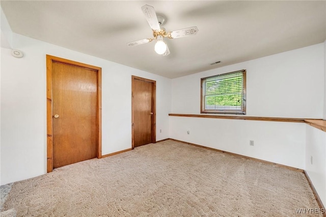 2350 Quaker Rd, Hartland, NY 14067 - unfurnished bedroom featuring carpet, baseboards, and ceiling fan