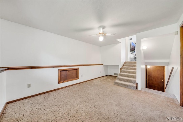 2350 Quaker Rd, Hartland, NY 14067 - finished basement with carpet flooring, baseboards, ceiling fan, and stairs