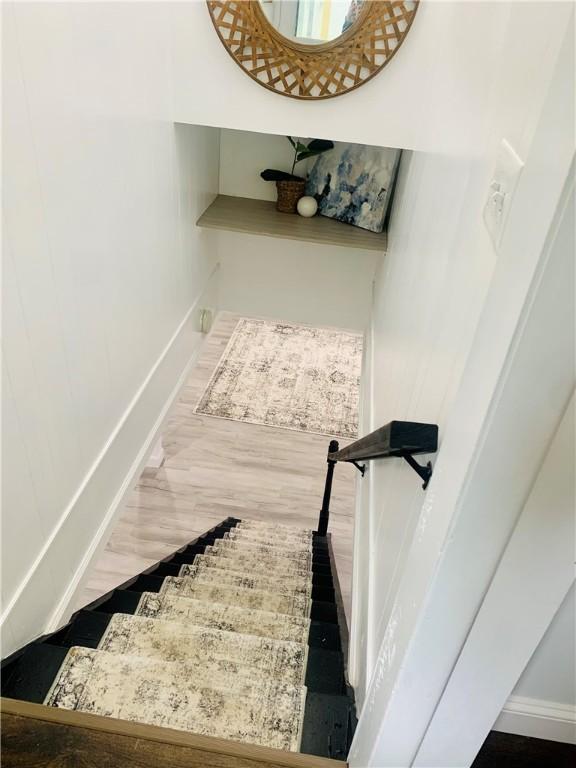 438 Hillview Ave, Southport, NY 14904 - stairs with baseboards and wood finished floors
