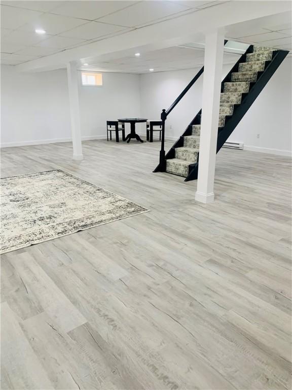 438 Hillview Ave, Southport, NY 14904 - basement with stairs, baseboards, and wood finished floors