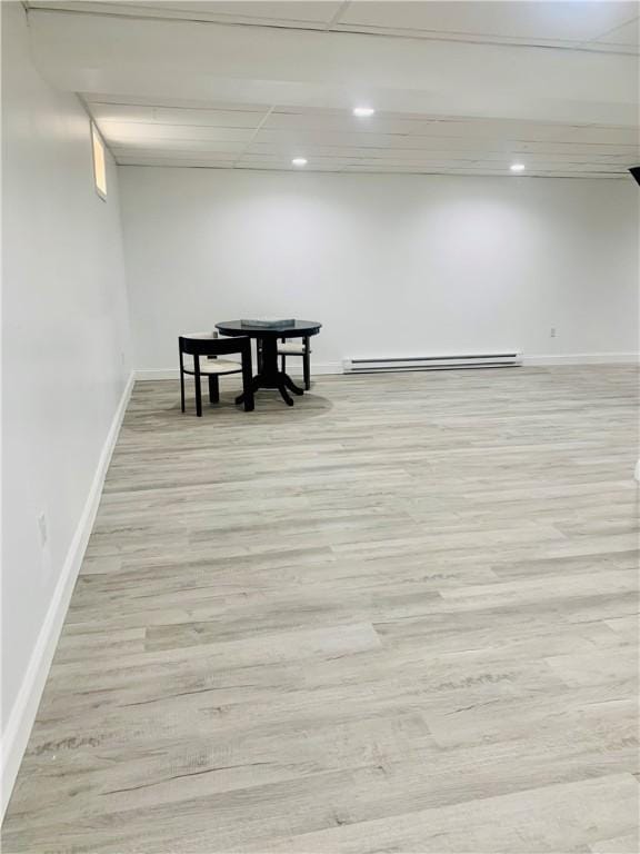 438 Hillview Ave, Southport, NY 14904 - basement with light wood-type flooring, baseboards, recessed lighting, and a baseboard heating unit