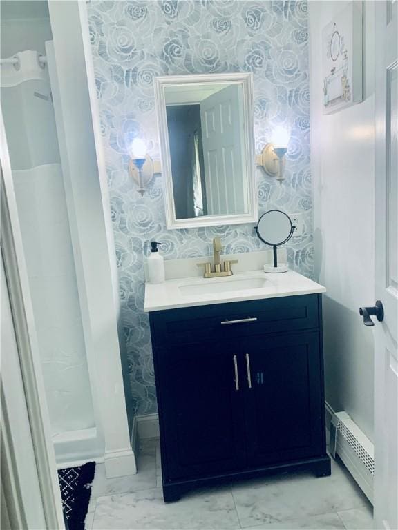 438 Hillview Ave, Southport, NY 14904 - full bathroom with wallpapered walls, a baseboard heating unit, vanity, marble look tiles, and baseboards