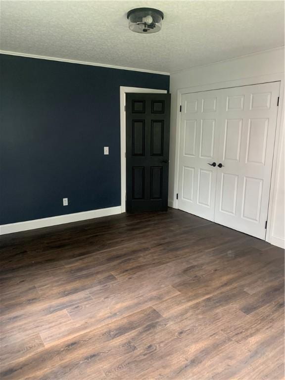 438 Hillview Ave, Southport, NY 14904 - entryway featuring dark wood finished floors, baseboards, a textured ceiling, and ornamental molding