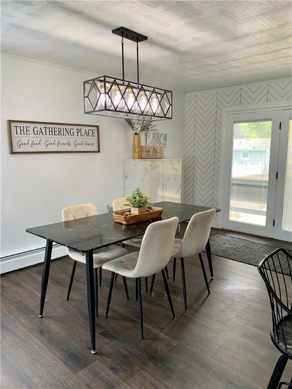 438 Hillview Ave, Southport, NY 14904 - dining space with wallpapered walls, dark wood finished floors, and baseboard heating