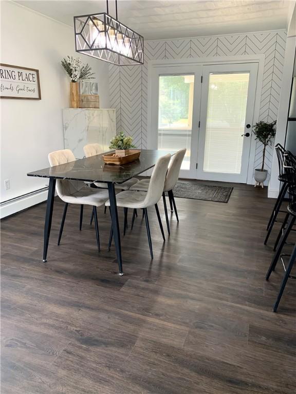 438 Hillview Ave, Southport, NY 14904 - dining room with baseboard heating, dark wood-style floors, and wallpapered walls