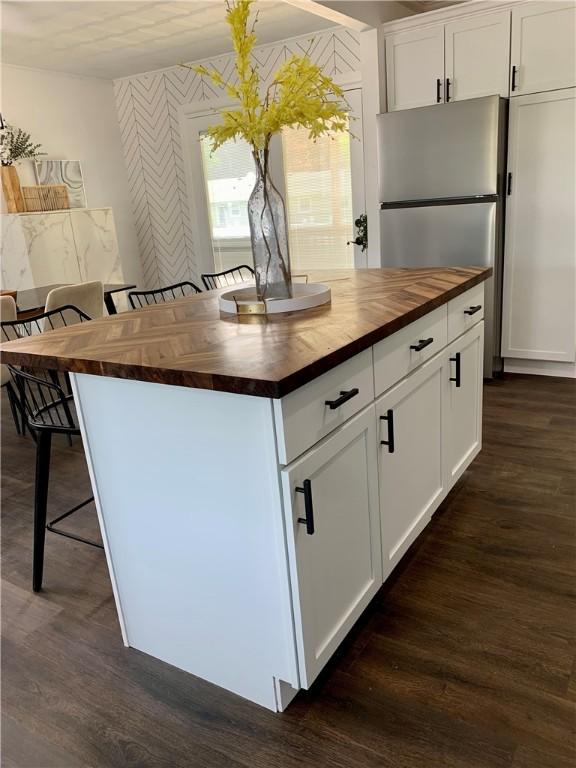 438 Hillview Ave, Southport, NY 14904 - kitchen with wooden counters, freestanding refrigerator, wallpapered walls, dark wood-style floors, and white cabinets