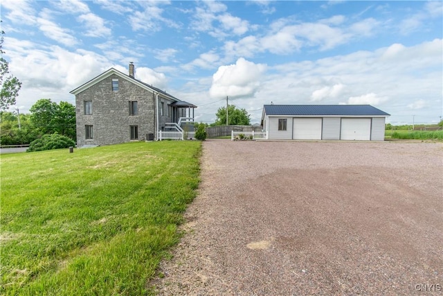 24401 Cheever Rd, Pamelia, NY 13601 - view of front of property featuring an outbuilding and a garage