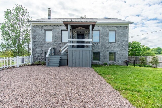 24401 Cheever Rd, Pamelia, NY 13601 - view of front of home with stone siding, metal roof, and stairs