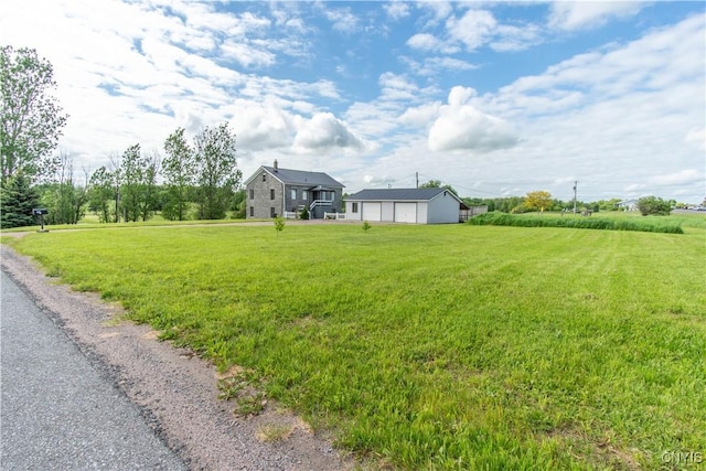 24401 Cheever Rd, Pamelia, NY 13601 - view of grassy yard with a garage