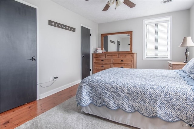 24401 Cheever Rd, Pamelia, NY 13601 - bedroom with wood finished floors, baseboards, and ceiling fan