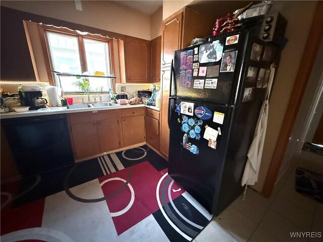 46 Cunard Rd, Buffalo, NY 14216 - kitchen with light countertops, black appliances, brown cabinetry, and a sink