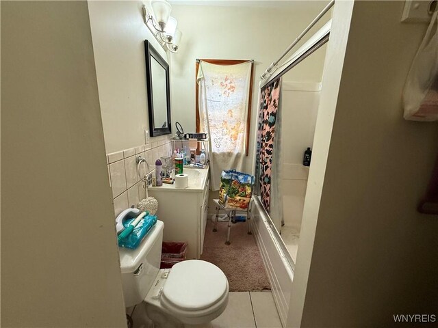 46 Cunard Rd, Buffalo, NY 14216 - bathroom featuring tile walls, toilet, tile patterned floors, vanity, and wainscoting