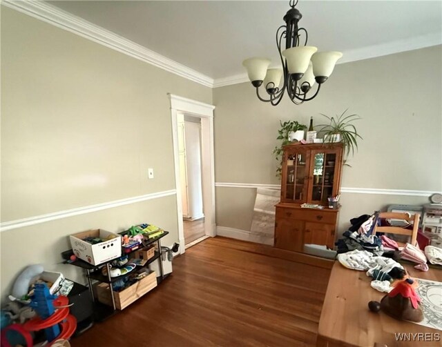 46 Cunard Rd, Buffalo, NY 14216 - dining area featuring wood finished floors, a chandelier, crown molding, and baseboards