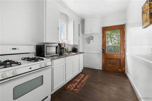 204 Crowley Ave, Buffalo, NY 14207 - kitchen featuring white gas range oven, white cabinets, and dark wood-style flooring