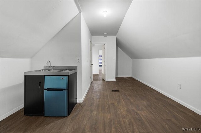204 Crowley Ave, Buffalo, NY 14207 - bonus room featuring a sink, dark wood-type flooring, lofted ceiling, and baseboards