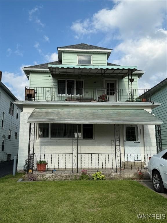 189 Lovering Ave, Buffalo, NY 14216 - view of front of property with a balcony and a front lawn