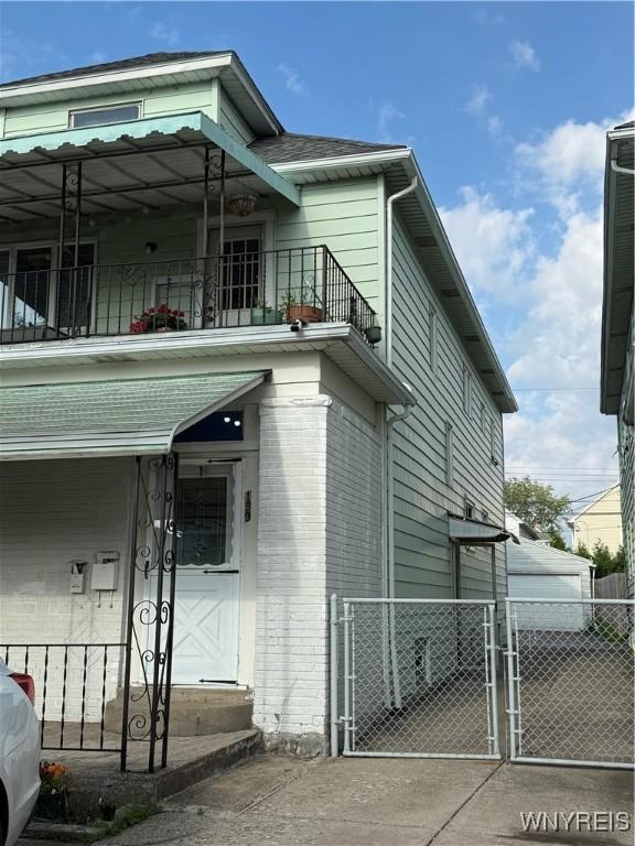 189 Lovering Ave, Buffalo, NY 14216 - view of property exterior with a balcony and a gate