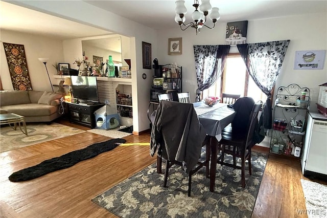 189 Lovering Ave, Buffalo, NY 14216 - dining room with a chandelier and wood finished floors