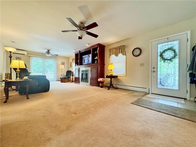 119 Park Ter, Big Flats, NY 14845 - carpeted living room featuring a baseboard heating unit, an AC wall unit, a fireplace with flush hearth, ceiling fan, and baseboards