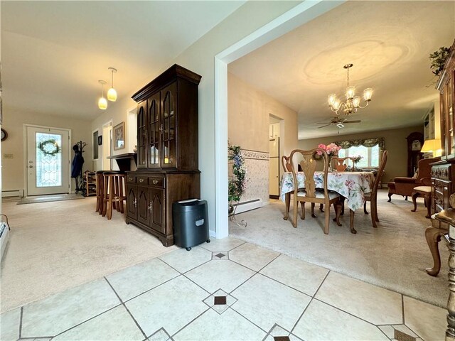 119 Park Ter, Big Flats, NY 14845 - dining room featuring light carpet, a chandelier, light tile patterned floors, and a baseboard radiator