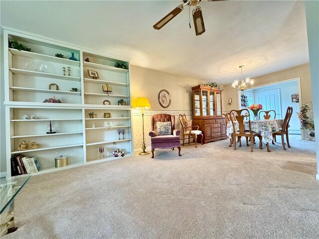 119 Park Ter, Big Flats, NY 14845 - living area with a chandelier, a ceiling fan, carpet, and a baseboard radiator