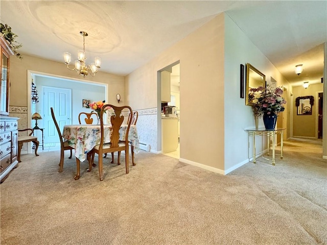 119 Park Ter, Big Flats, NY 14845 - carpeted dining room with a chandelier, baseboards, and a baseboard heating unit