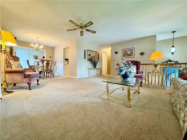 119 Park Ter, Big Flats, NY 14845 - carpeted living room featuring a ceiling fan, a chandelier, and baseboards