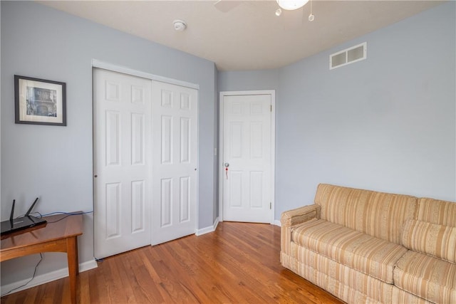1108 Brick Landing Pl, Webster, NY 14580 - sitting room with baseboards, wood finished floors, and a ceiling fan
