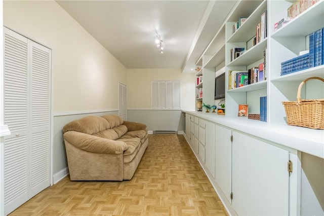 1108 Brick Landing Pl, Webster, NY 14580 - sitting room featuring rail lighting, baseboard heating, and baseboards