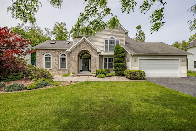 1108 Brick Landing Pl, Webster, NY 14580 - traditional-style house with asphalt driveway, a garage, a front yard, and brick siding