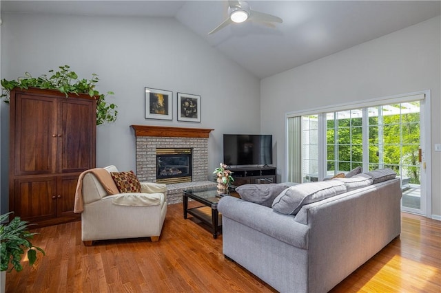 1108 Brick Landing Pl, Webster, NY 14580 - living area featuring high vaulted ceiling, ceiling fan, light wood-style flooring, and a fireplace