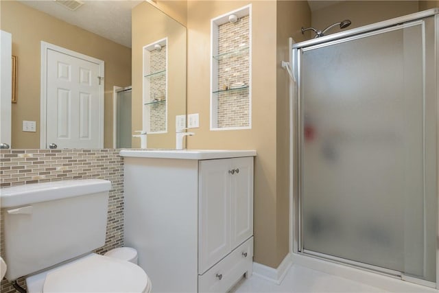 1108 Brick Landing Pl, Webster, NY 14580 - full bath featuring a stall shower, toilet, vanity, and backsplash