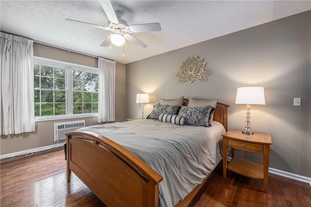 1108 Brick Landing Pl, Webster, NY 14580 - bedroom featuring baseboards, hardwood / wood-style floors, a wall unit AC, a ceiling fan, and a textured ceiling
