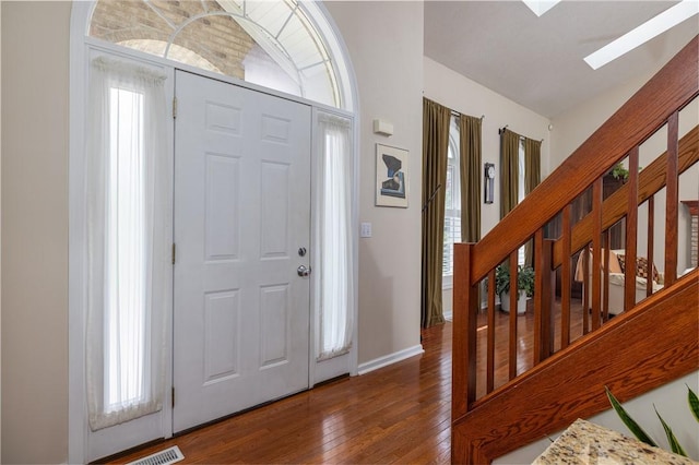 1108 Brick Landing Pl, Webster, NY 14580 - entryway with hardwood / wood-style floors, a skylight, plenty of natural light, and baseboards